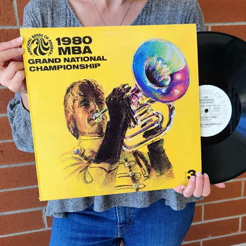 Holding record album cover