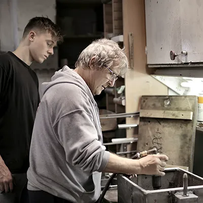 Business Video Productions Two men working in an industrial setting