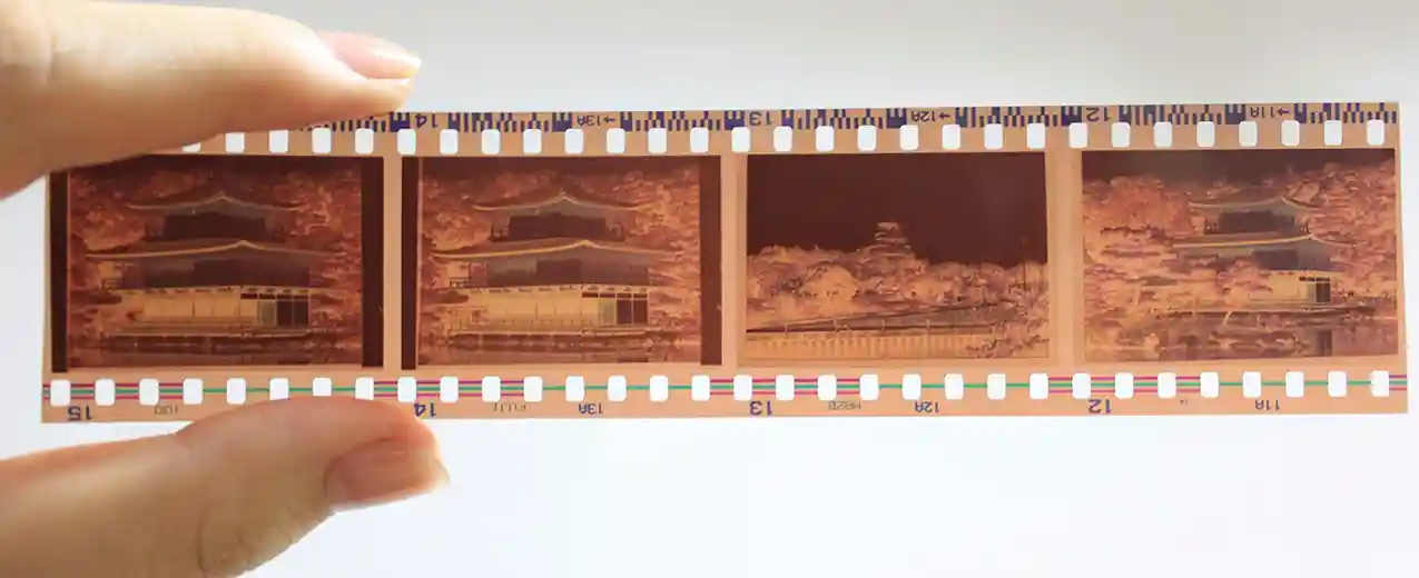 Hand holding 35mm negatives