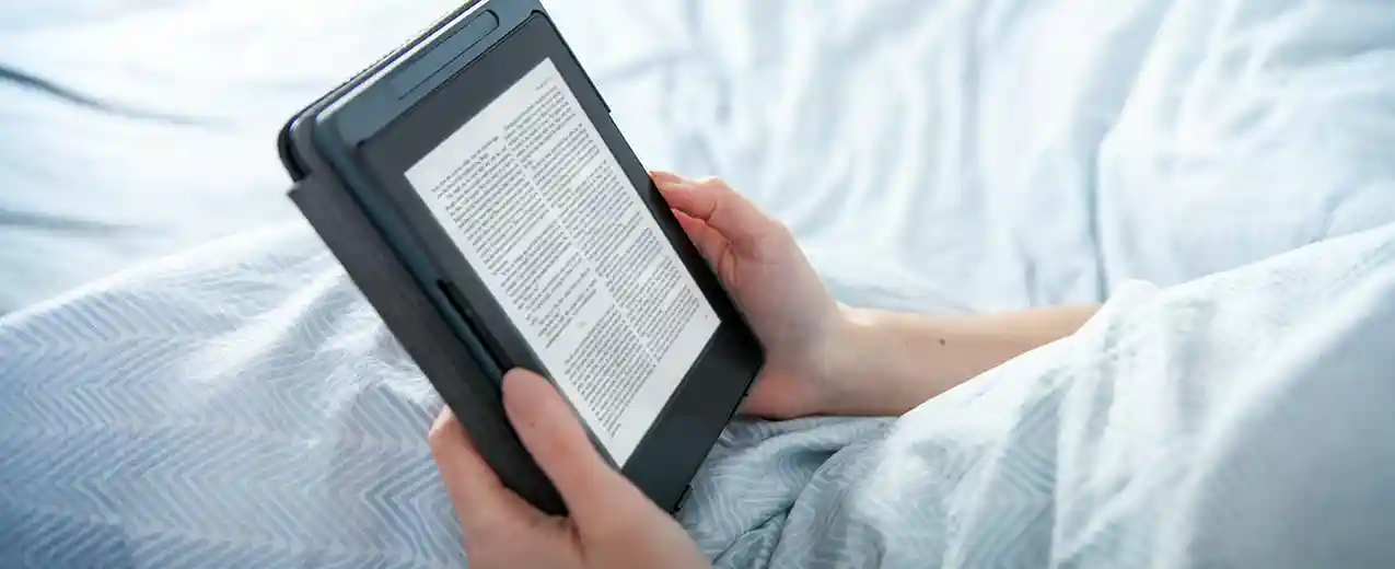 Books scanned to digital files Tablet on table showing scanned book